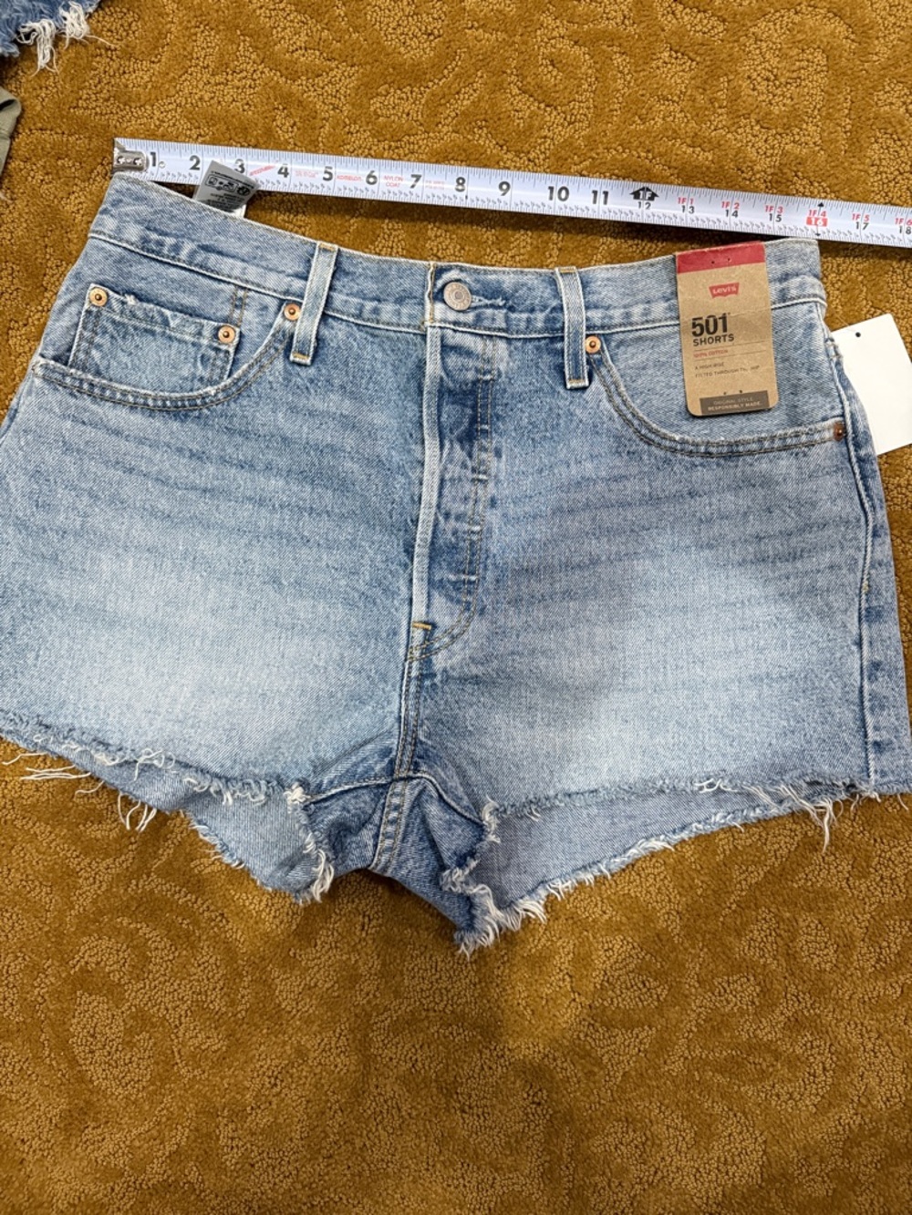Levi’s 501 denim button fly jean shorts, new with tags. Size 32